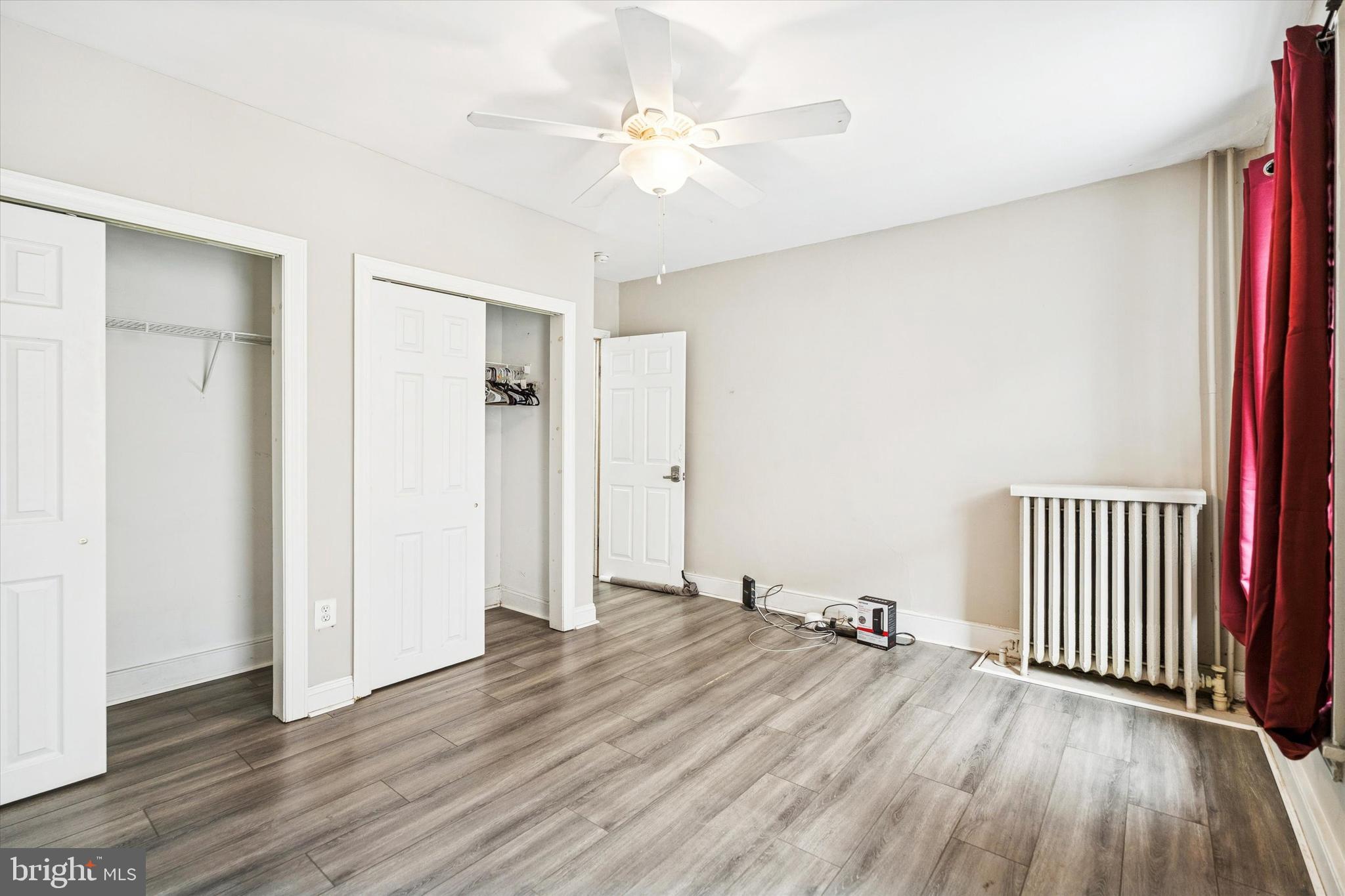 352 Carson Street Philadelphia, PA 19128 - Photo 16 of 35 an empty room with wooden floor and a ceiling fan
