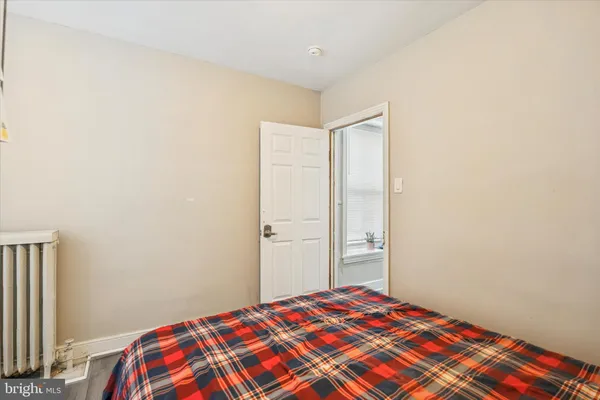 a bedroom with a bed and a closet