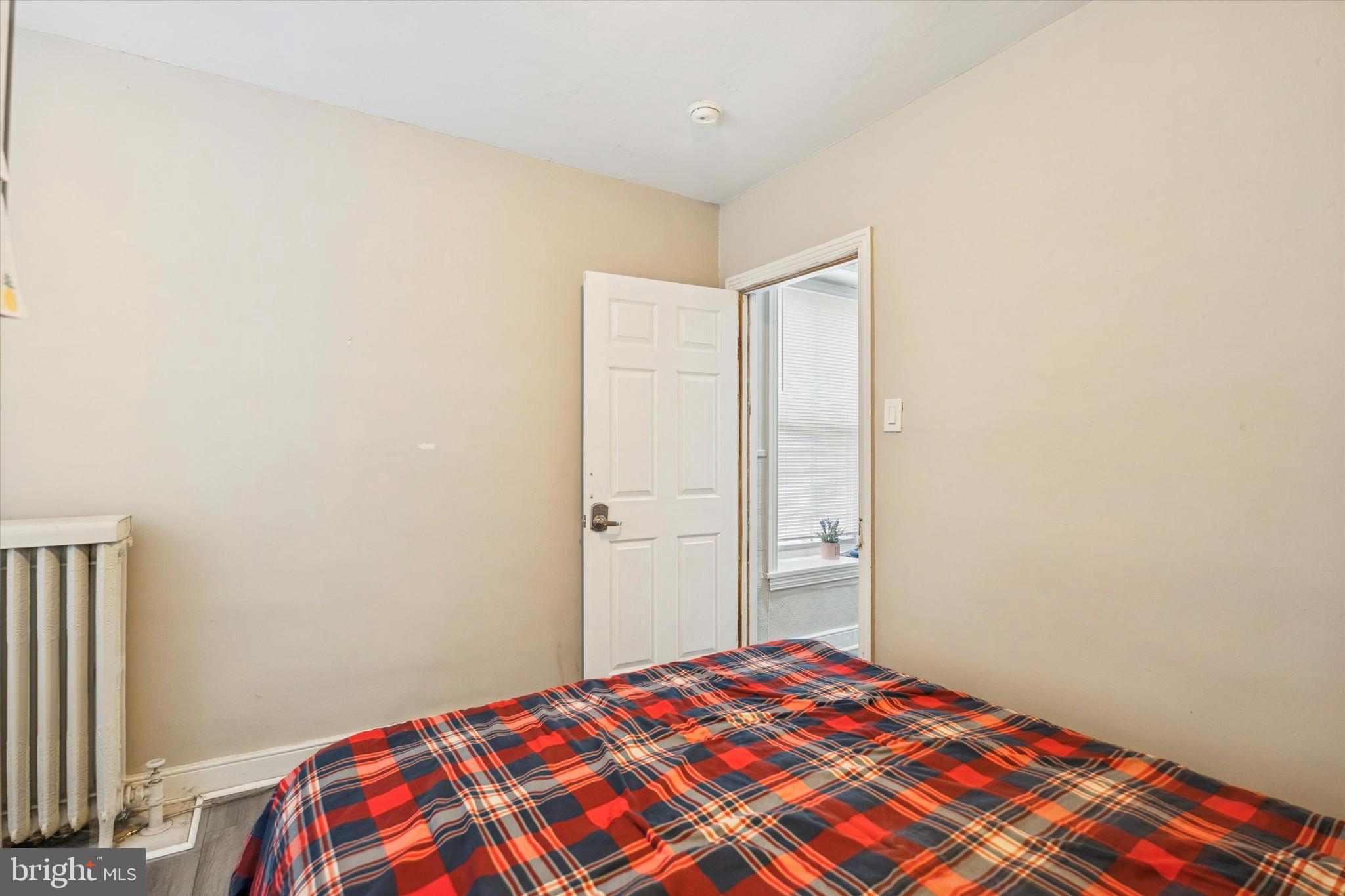 352 Carson Street Philadelphia, PA 19128 - Photo 20 of 35 a bedroom with a bed and a closet