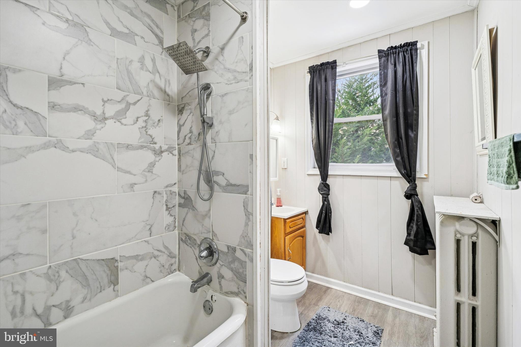 352 Carson Street Philadelphia, PA 19128 - Photo 21 of 35 a white toilet sitting next to a bath tub and a shower