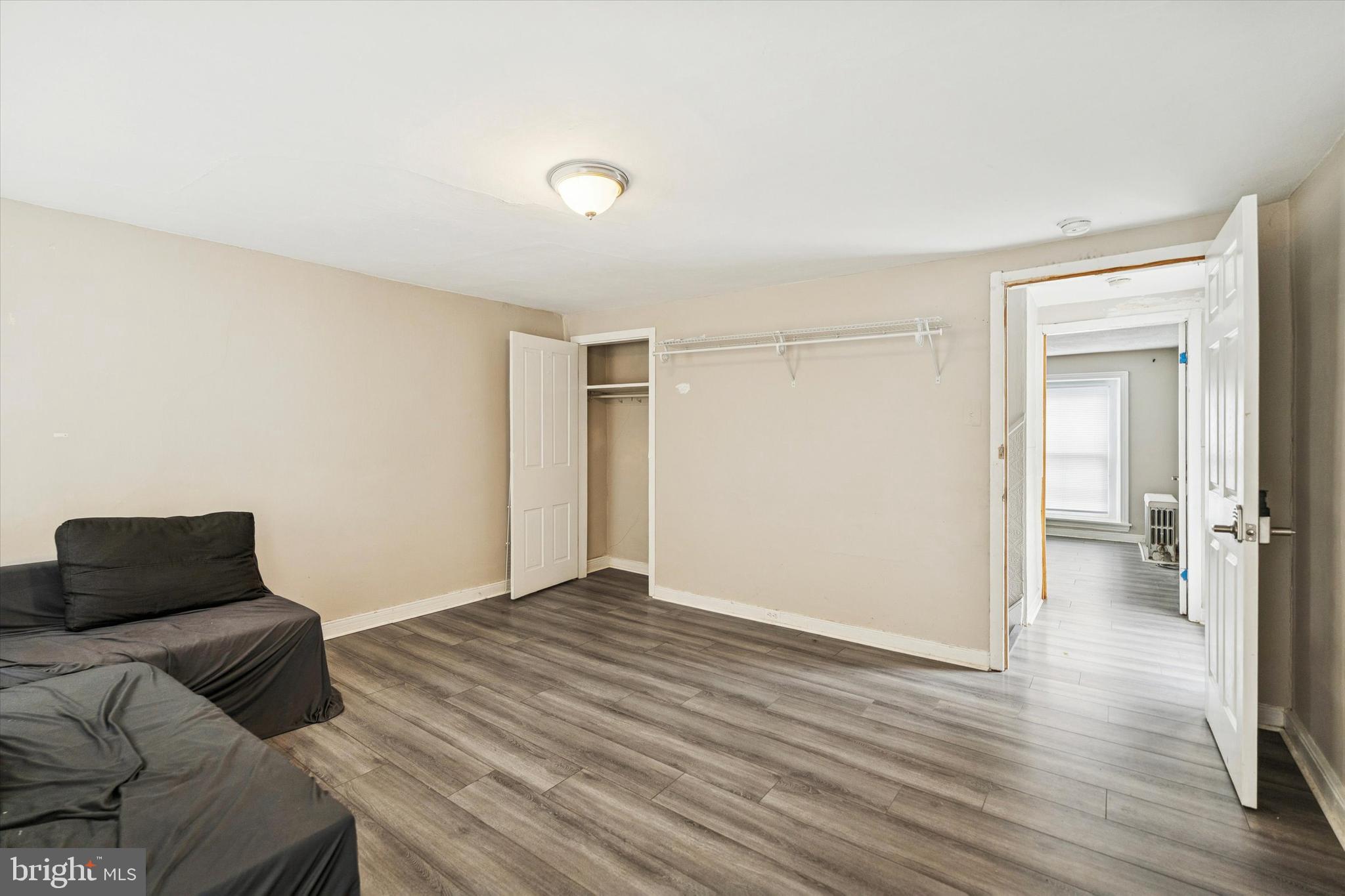 352 Carson Street Philadelphia, PA 19128 - Photo 25 of 35 a bedroom with a bed and wooden floor