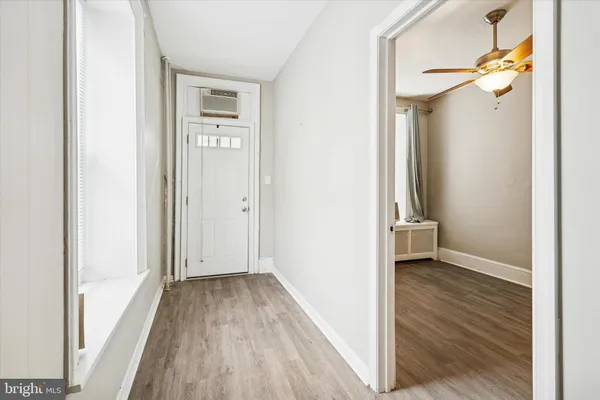 a view of a hallway view with wooden floor