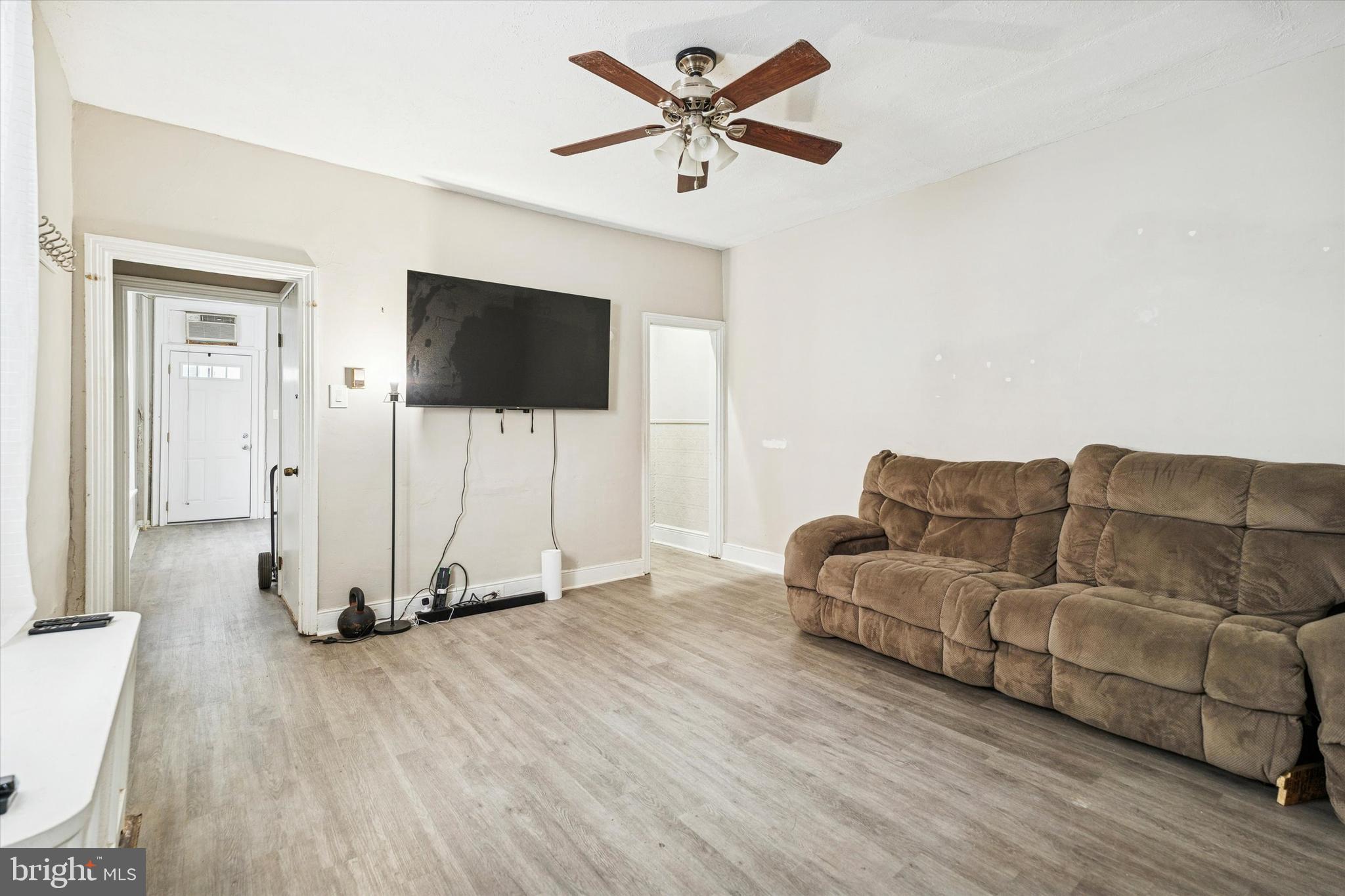 352 Carson Street Philadelphia, PA 19128 - Photo 6 of 35 a living room with furniture and a flat screen tv