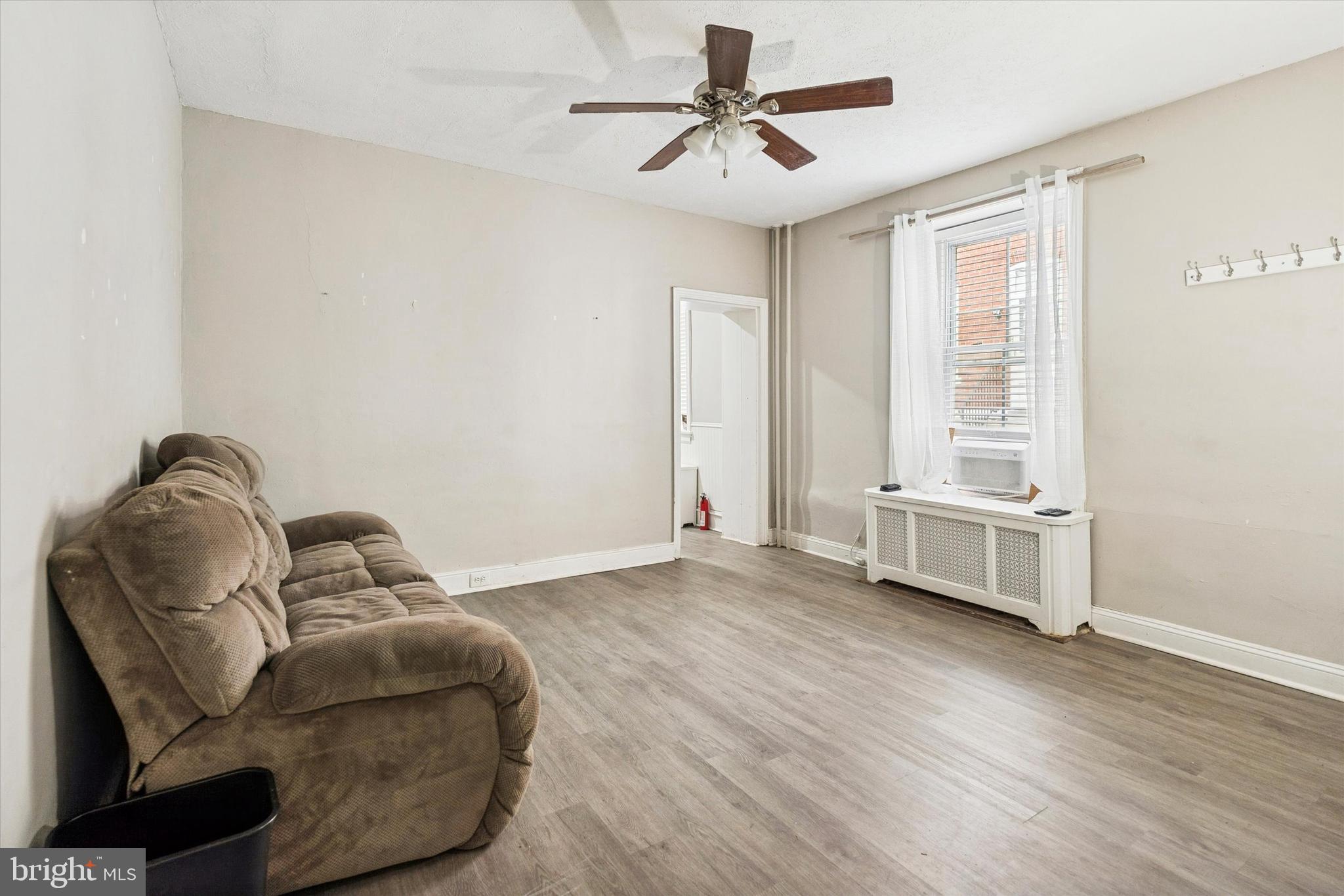 352 Carson Street Philadelphia, PA 19128 - Photo 7 of 35 a living room with furniture and a window