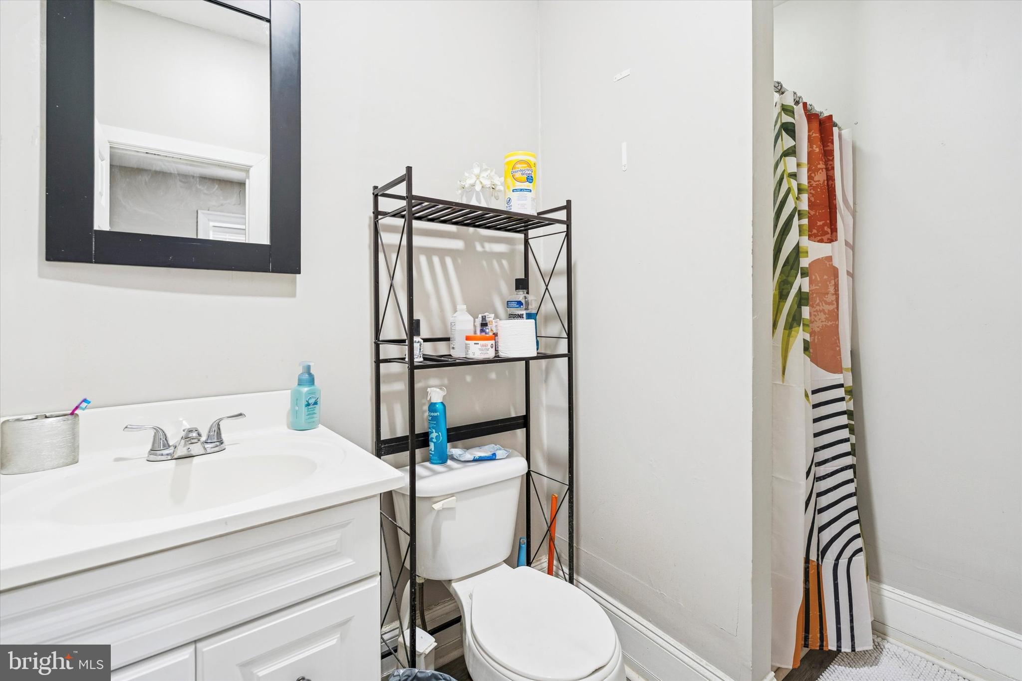352 Carson Street Philadelphia, PA 19128 - Photo 9 of 35 a bathroom with a sink toilet and mirror