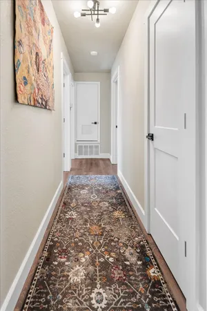 a very nice looking hallway with a carpet