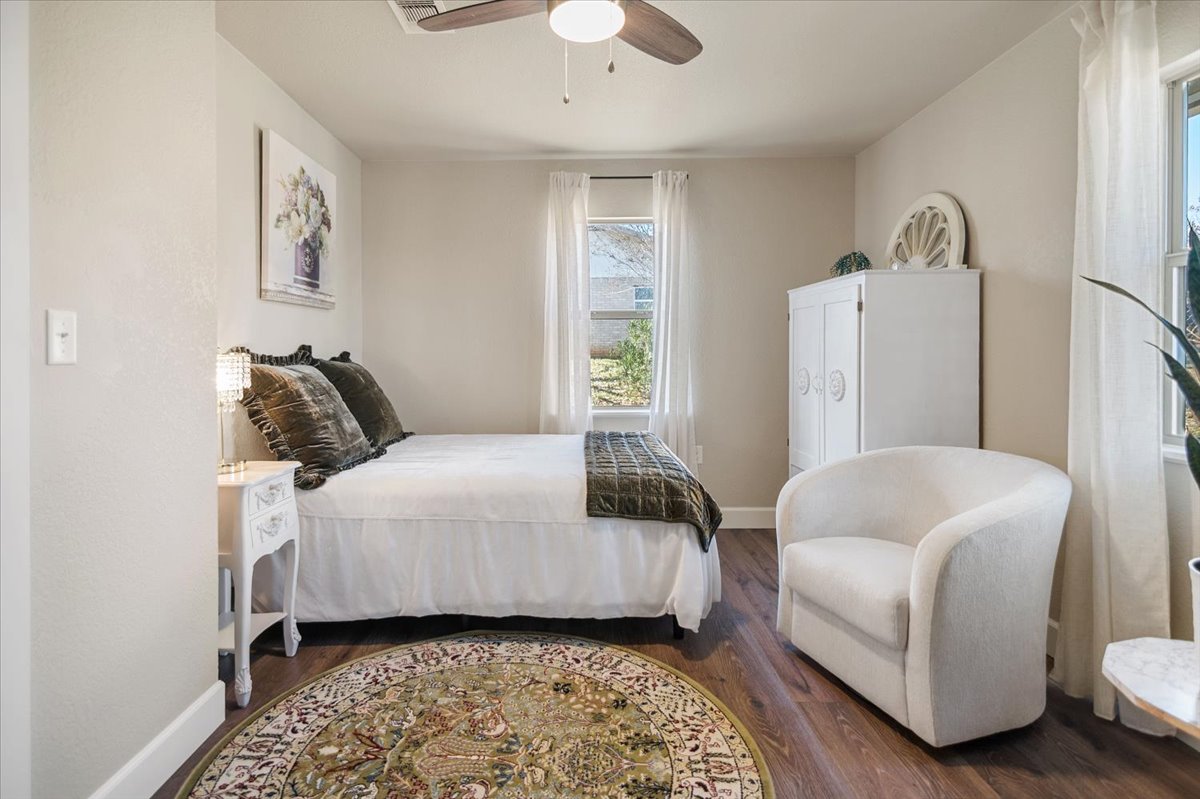 1236 Martin Street Mason, TX 76856 - Photo 20 of 40 a bedroom with a bed and a couch