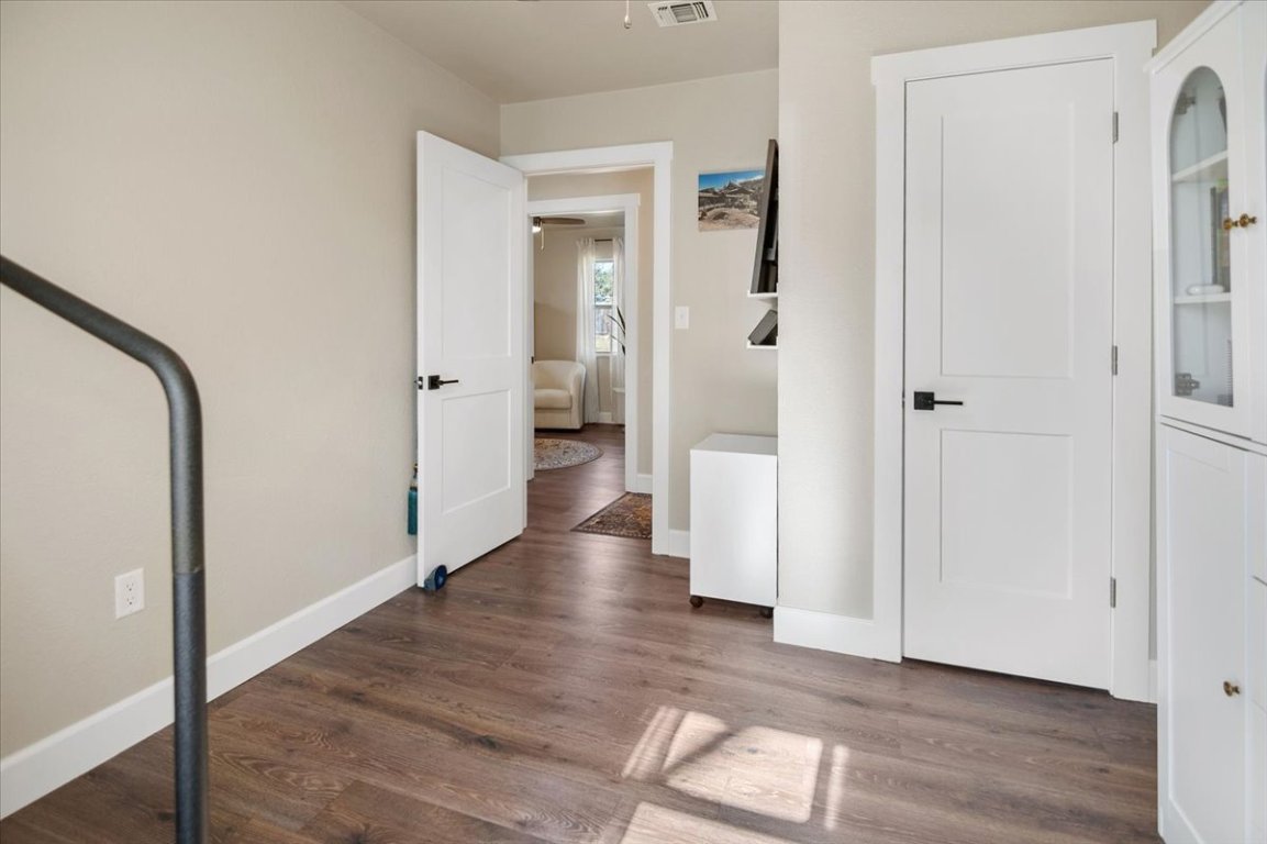 1236 Martin Street Mason, TX 76856 - Photo 25 of 40 a view of a hallway with wooden floor