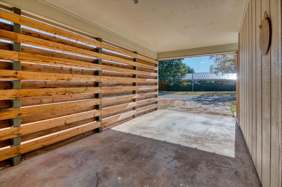 1236 Martin Street Mason, TX 76856 - Photo 32 of 40 a view of a room with stairs and a wooden floor