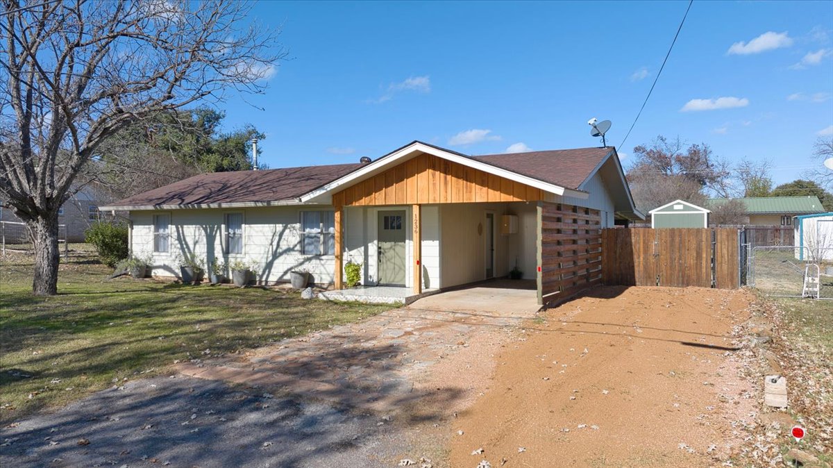 1236 Martin Street Mason, TX 76856 - Photo 4 of 40 a front view of a house with a yard