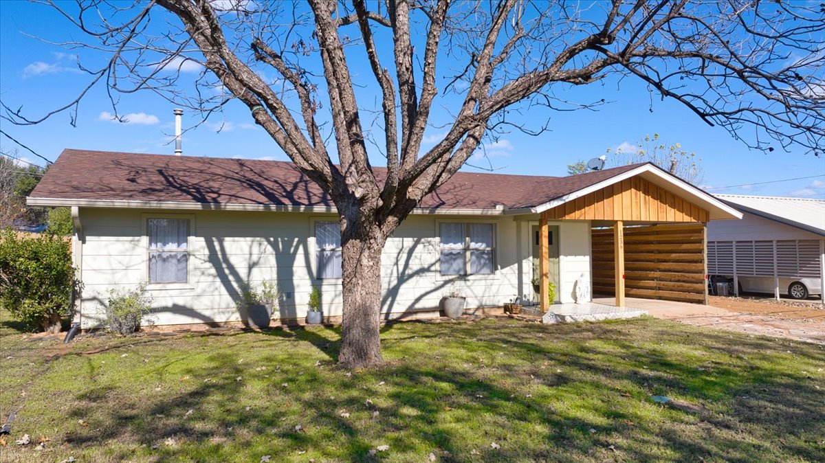 1236 Martin Street Mason, TX 76856 - Photo 5 of 40 a view of a house with a yard porch and furniture