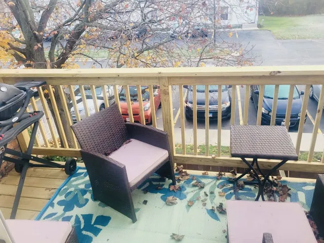 a view of a chairs and table in patio