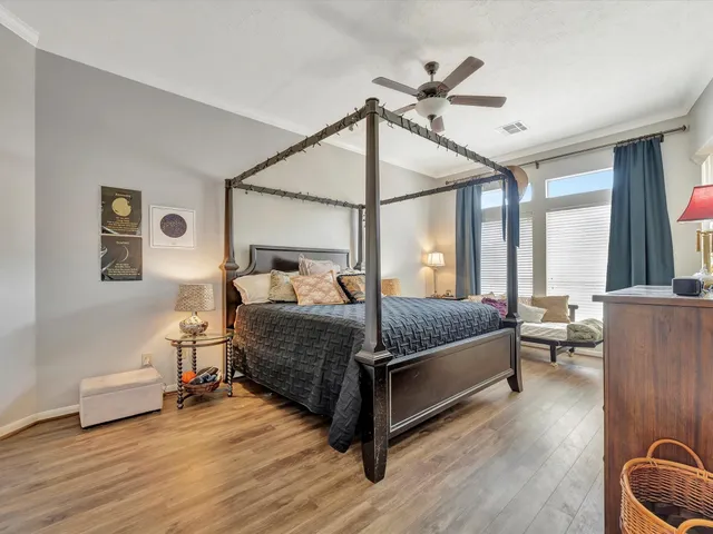 a bedroom with a bed and window