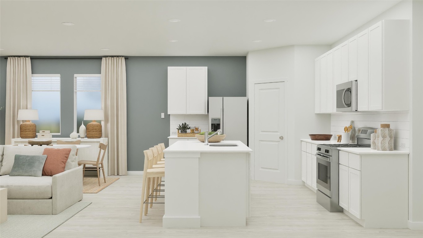 117 Stumpy Street San Marcos, TX 78666 - Photo 14 of 30 a living room with kitchen island furniture and a fireplace