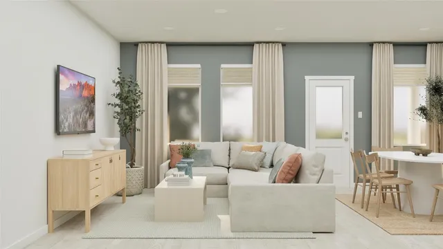 a living room with furniture and large windows
