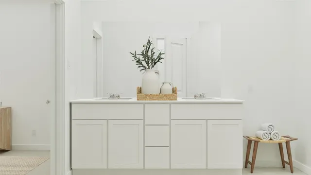 a bathroom with a sink and mirror
