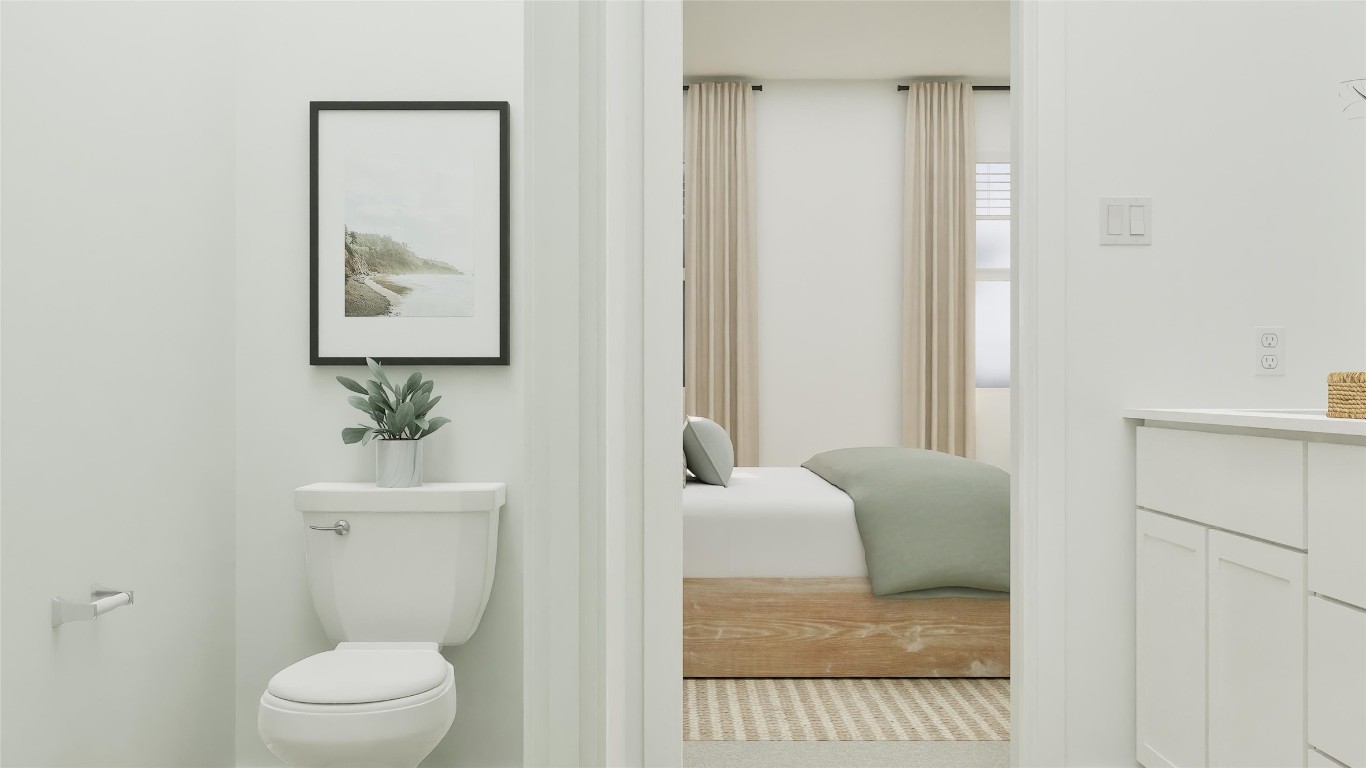 117 Stumpy Street San Marcos, TX 78666 - Photo 24 of 30 a bathroom with a toilet a sink and mirror