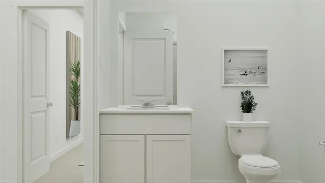 a bathroom with a sink a toilet and mirror