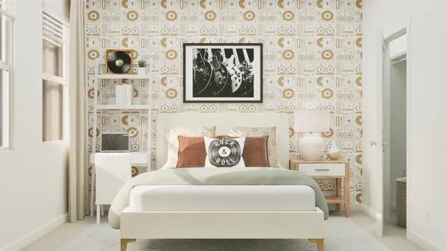 a bedroom with a bed and wall painting