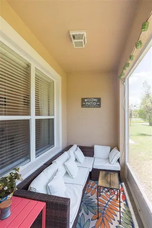 a picture of table room with wooden floor and window