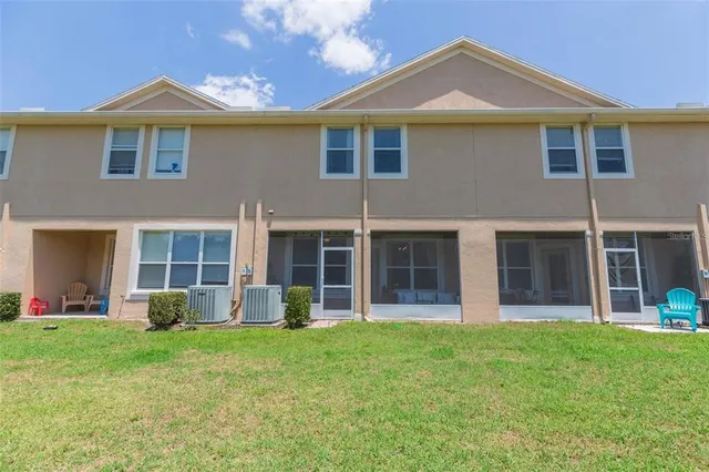 a front view of a house with a garden and yard