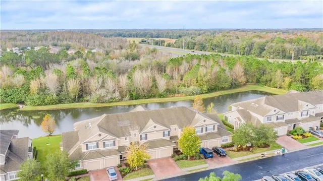 an aerial view of a house with a lake view