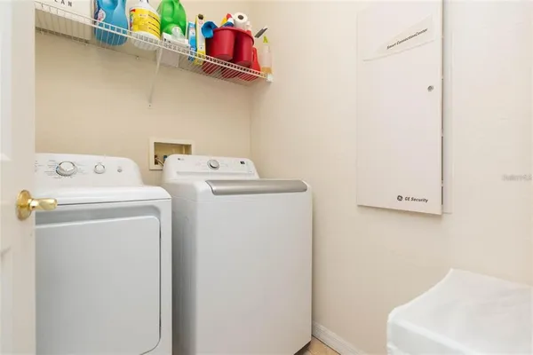 a utility room with dryer and washer