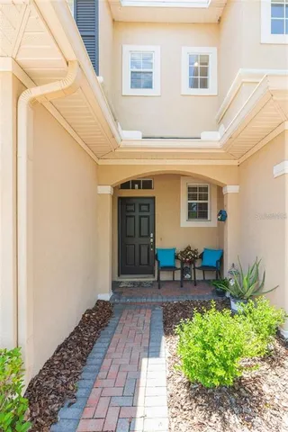 a front view of house with yard outdoor seating and barbeque oven