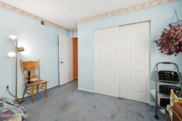 a bathroom with a sink toilet double vanity and shower