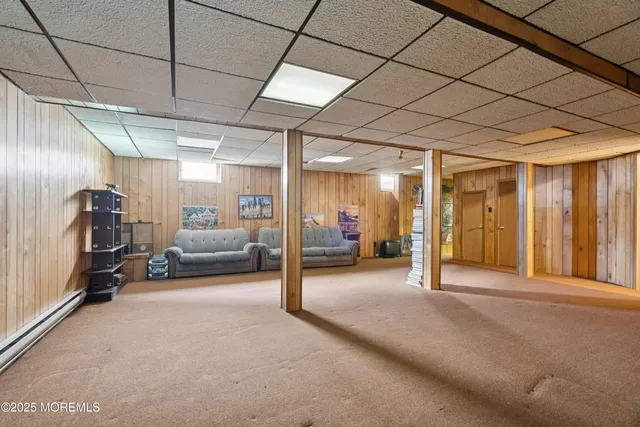 a table and chairs with the view of lake in the background