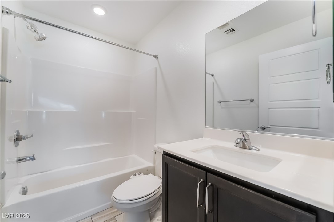 715 Pickled Pepper Place Henderson, NV 89011 - Photo 25 of 31 Full bathroom featuring shower / washtub combination, vanity, and recessed lighting