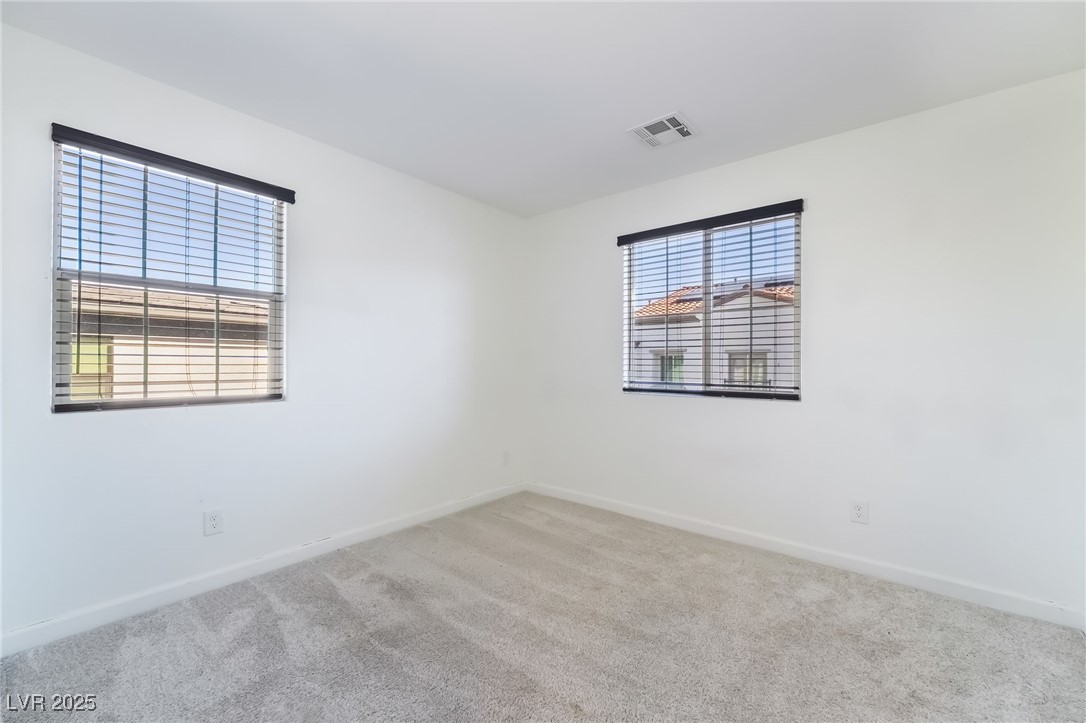 715 Pickled Pepper Place Henderson, NV 89011 - Photo 26 of 31 Carpeted empty room with baseboards