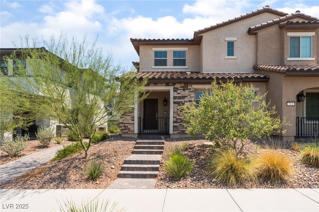 715 Pickled Pepper Place Henderson, NV 89011 - Photo 29 of 31 Mediterranean / spanish-style house with stucco siding, stone siding, and a tiled roof