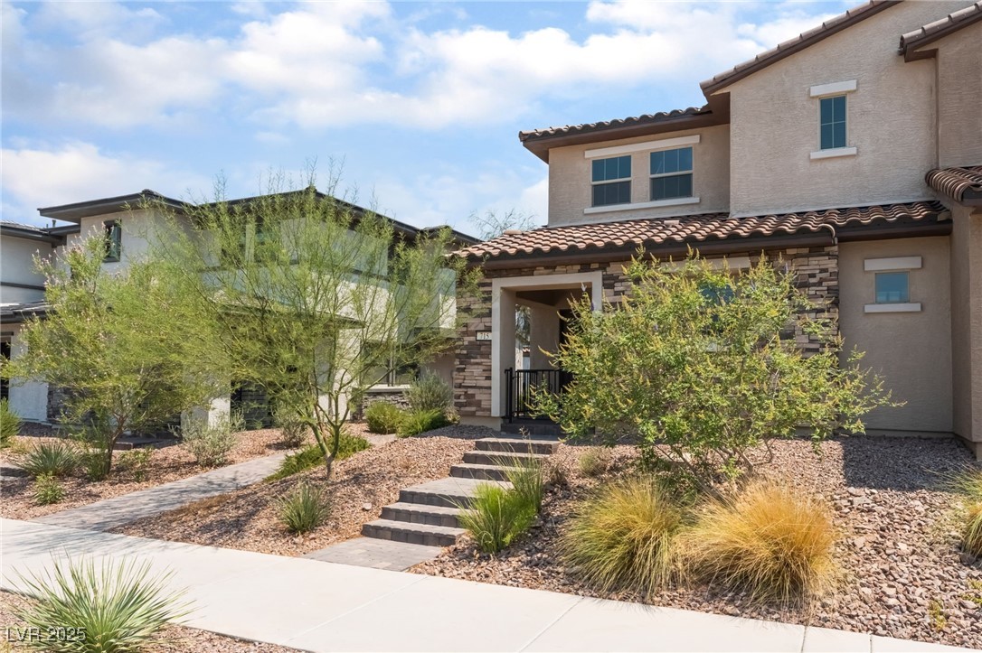 715 Pickled Pepper Place Henderson, NV 89011 - Photo 31 of 31 Mediterranean / spanish home with stone siding, stucco siding, and a tile roof