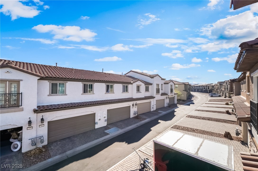 715 Pickled Pepper Place Henderson, NV 89011 - Photo 5 of 31 View of road featuring a residential view