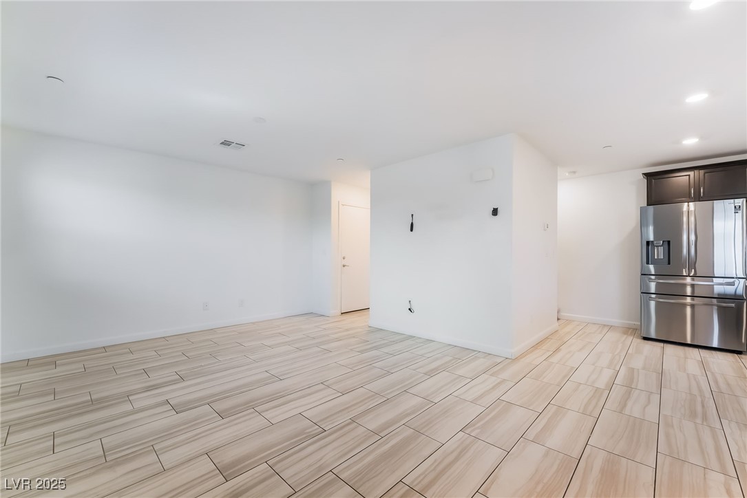 715 Pickled Pepper Place Henderson, NV 89011 - Photo 6 of 31 Spare room with recessed lighting and wood finish floors