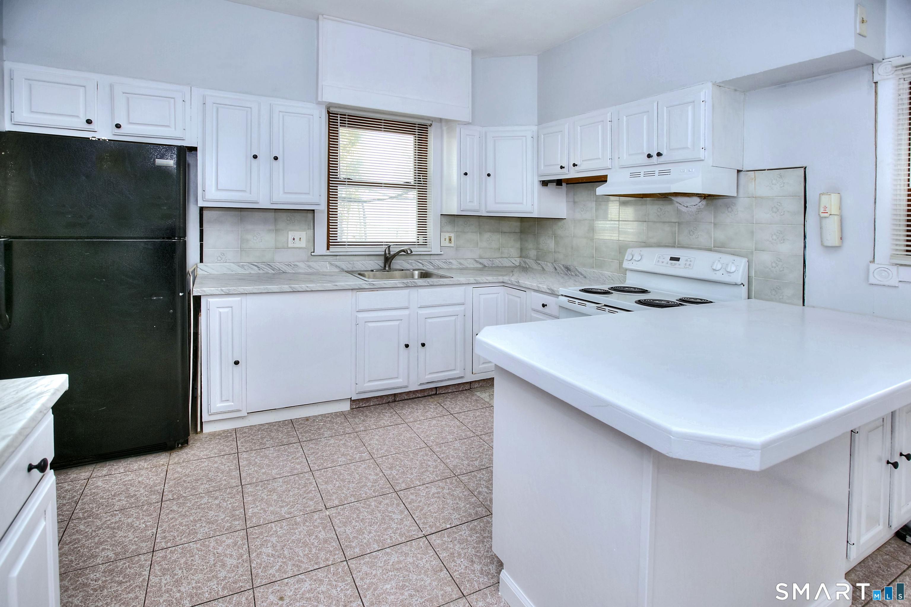115 3rd Street Hamden, CT 06514 - Photo 11 of 34 a kitchen with a sink a stove and refrigerator