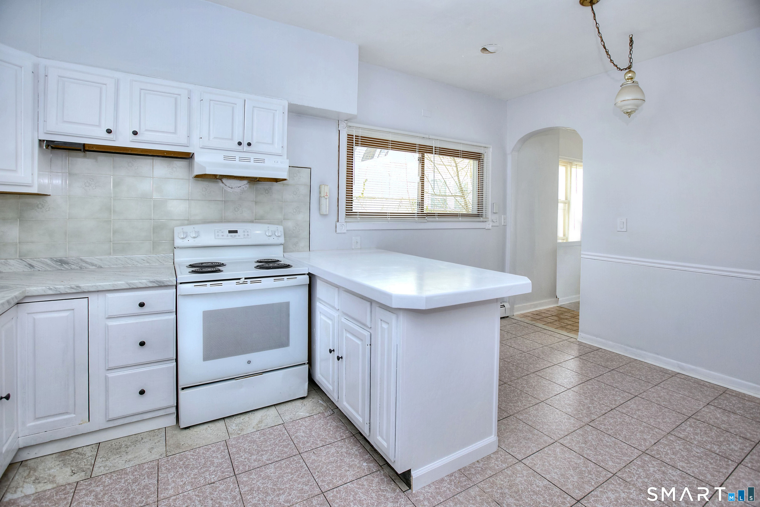 115 3rd Street Hamden, CT 06514 - Photo 12 of 34 a kitchen with white cabinets and sink