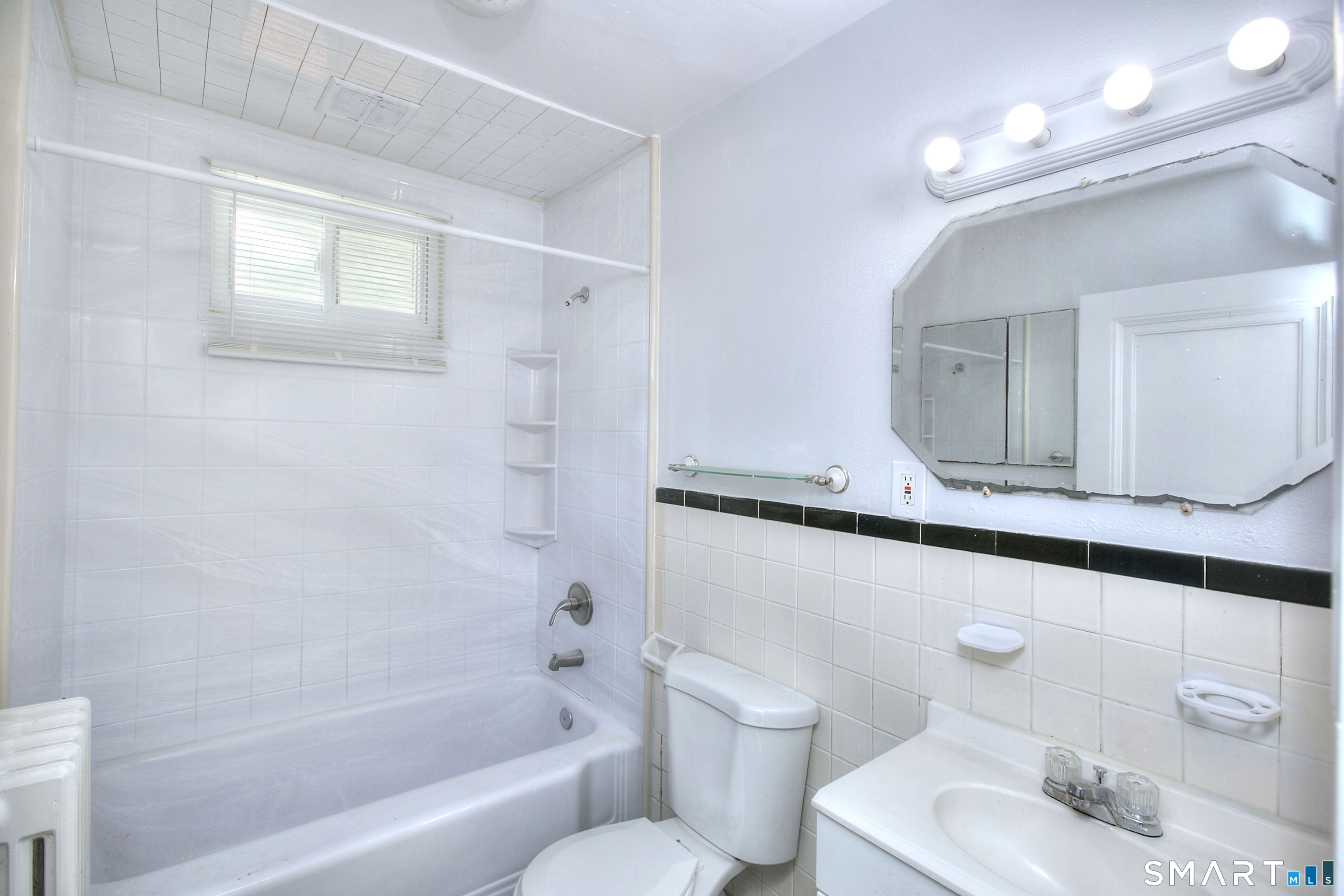 115 3rd Street Hamden, CT 06514 - Photo 14 of 34 a bathroom with a sink a toilet and bathtub