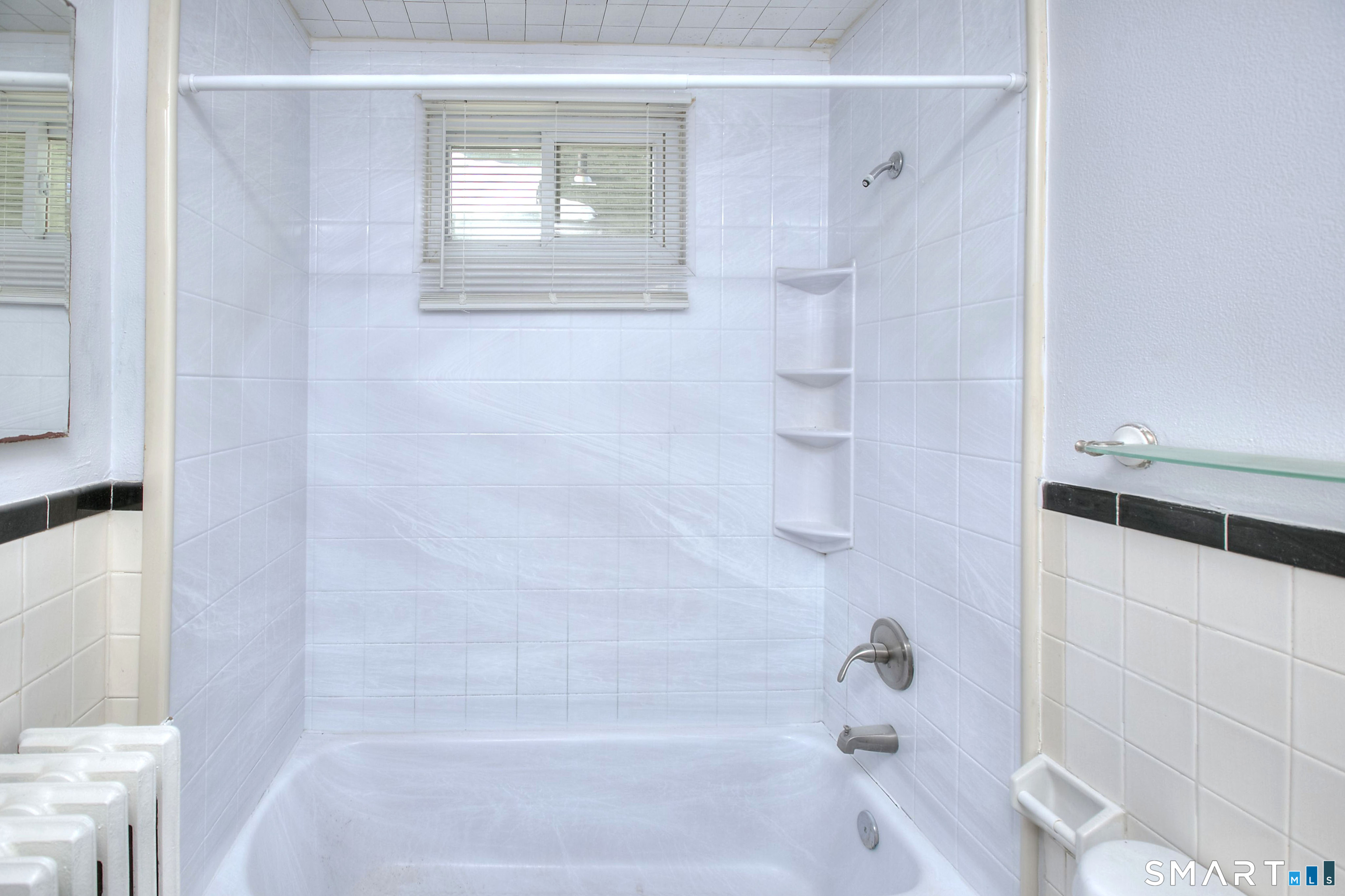 115 3rd Street Hamden, CT 06514 - Photo 16 of 34 a bathroom with a bathtub and a shower