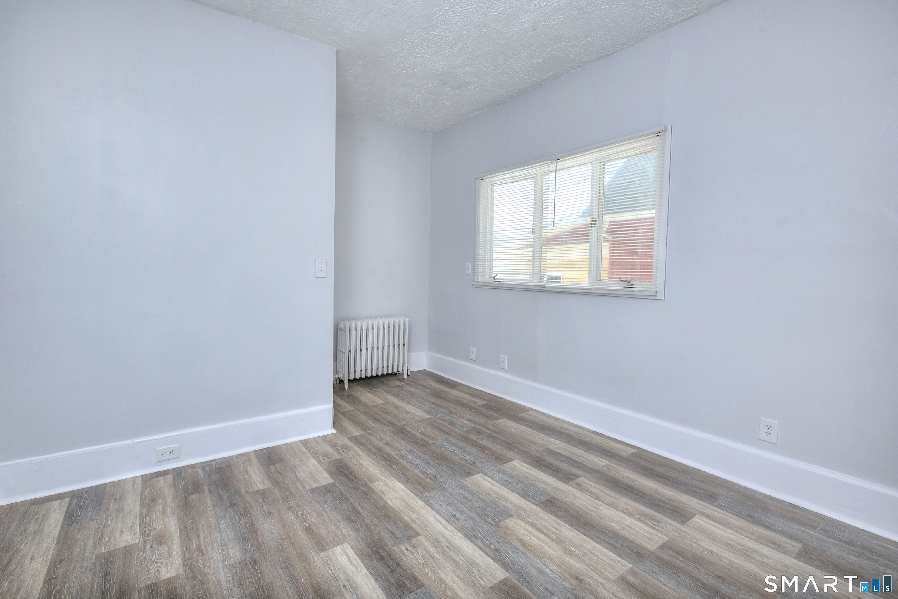 115 3rd Street Hamden, CT 06514 - Photo 17 of 34 an empty room with a window