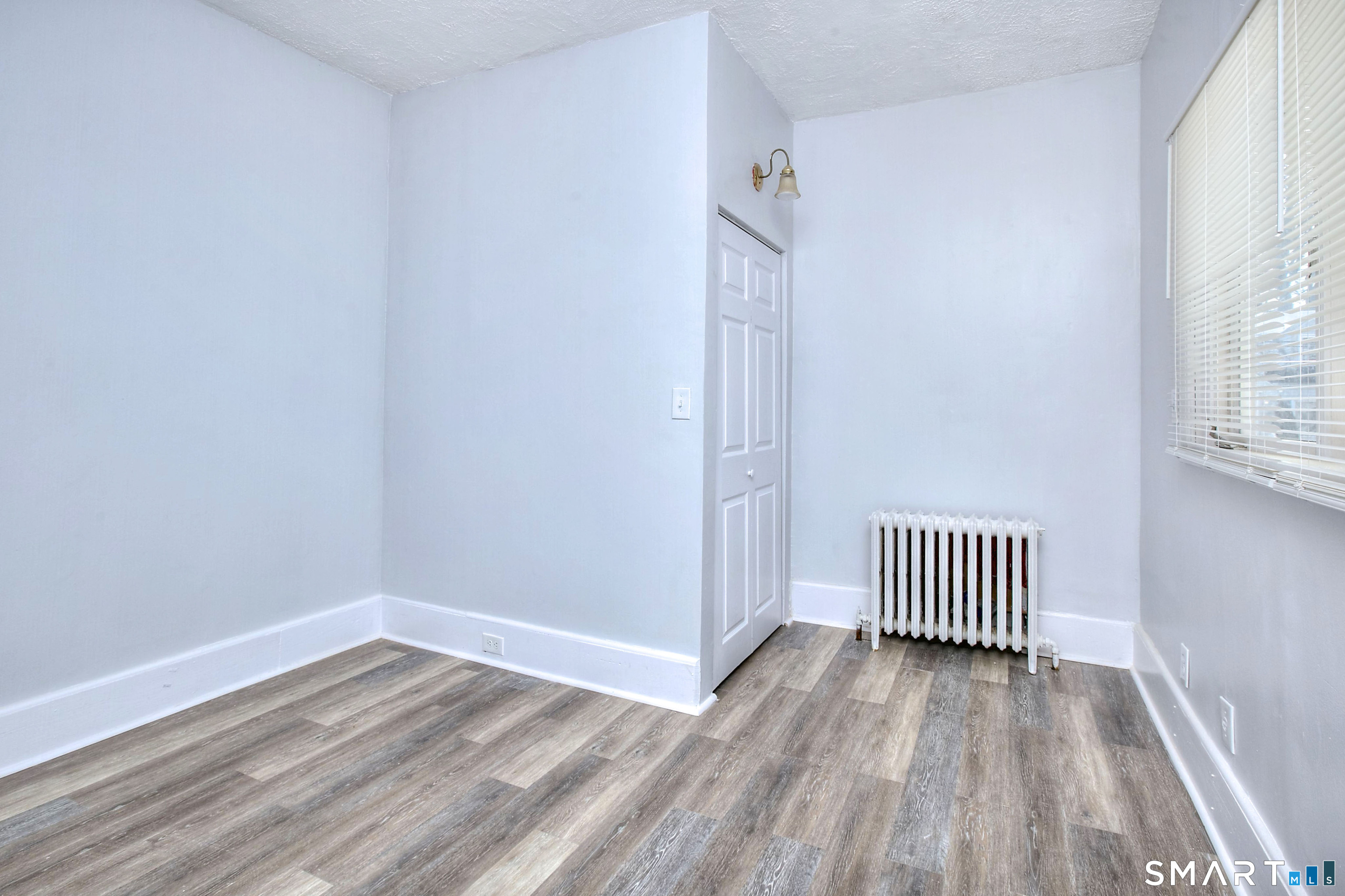 115 3rd Street Hamden, CT 06514 - Photo 18 of 34 a view of a room with wooden floor and a window