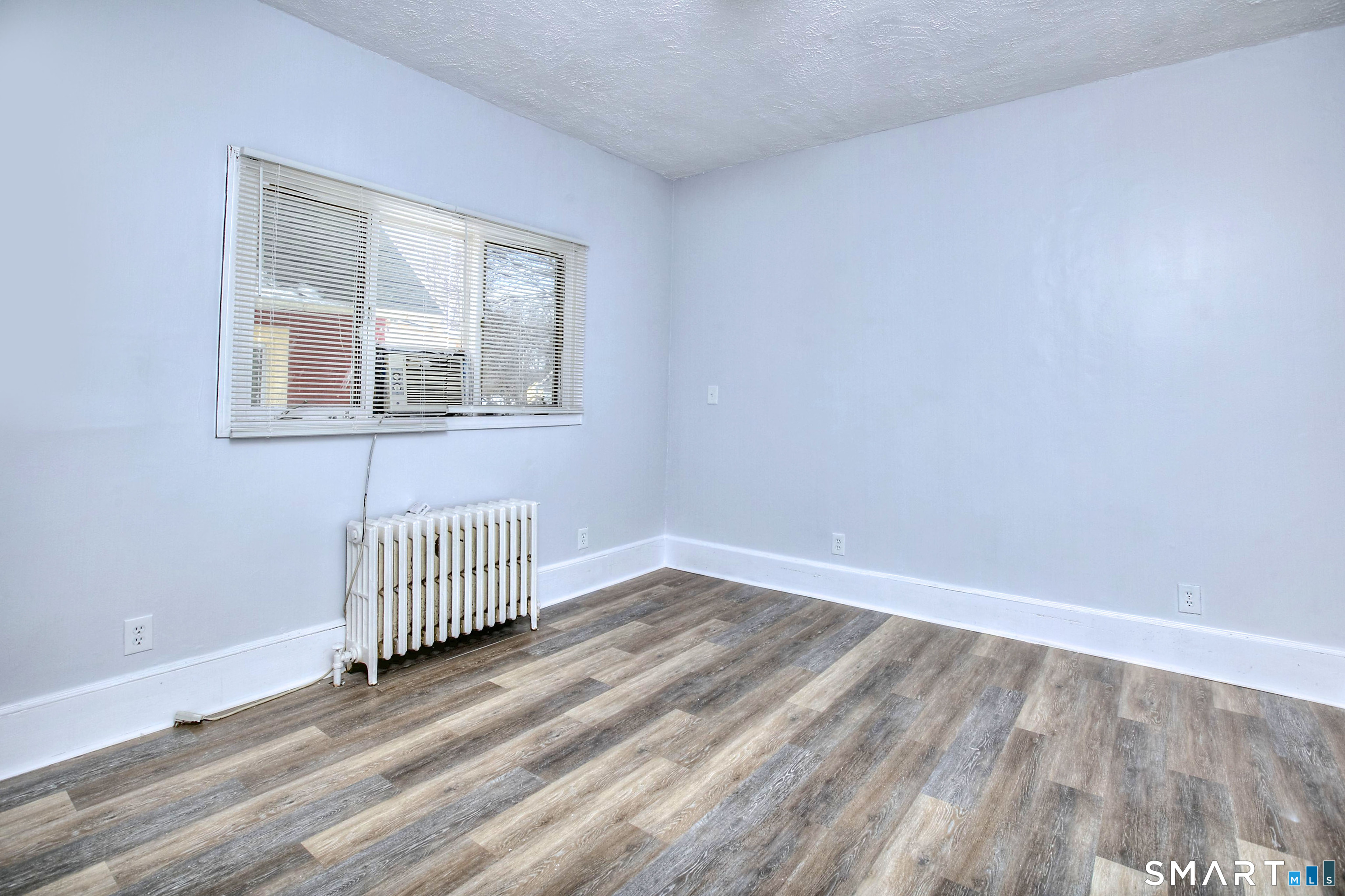 115 3rd Street Hamden, CT 06514 - Photo 19 of 34 a view of a room with wooden floor and window