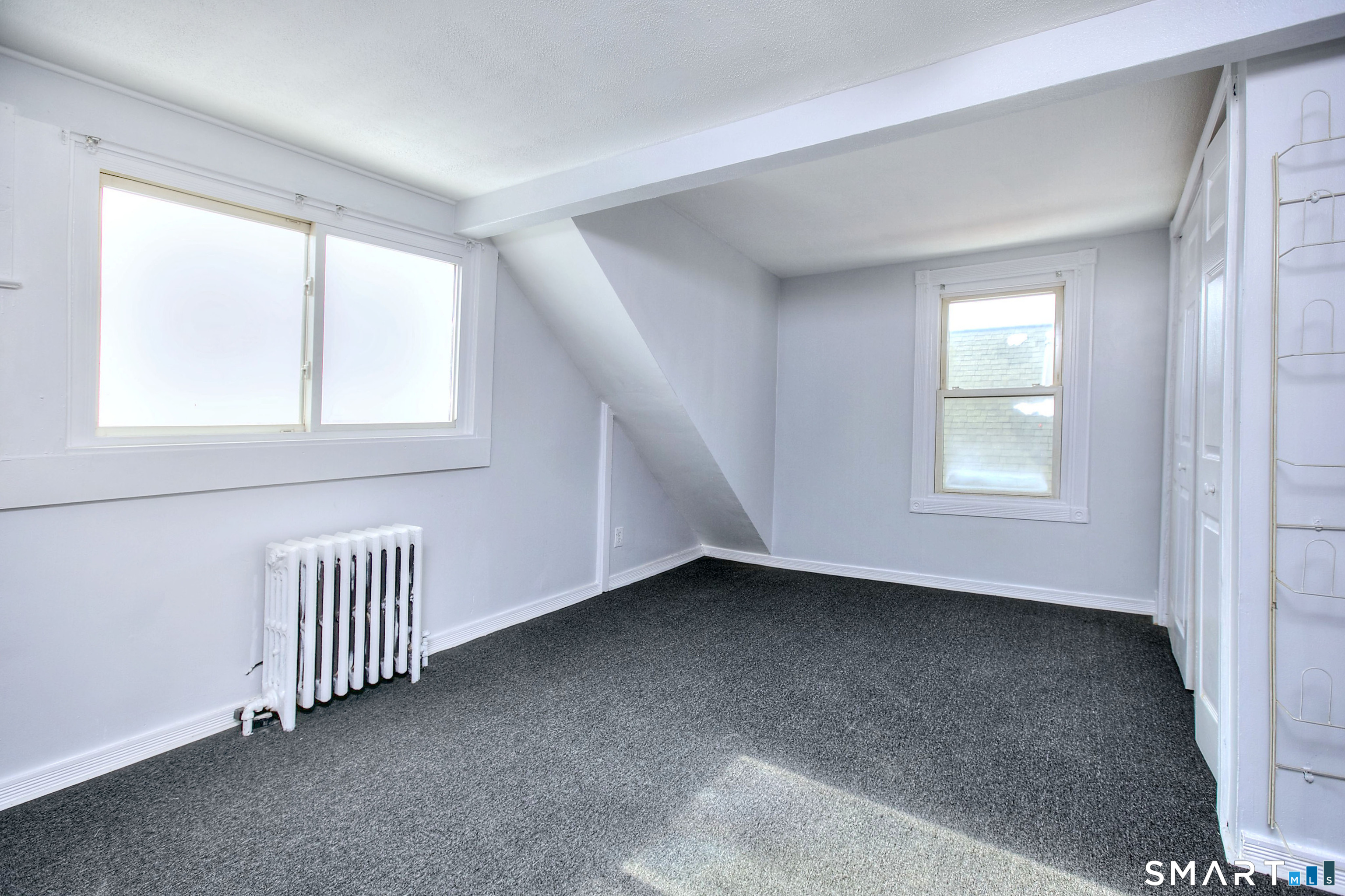 115 3rd Street Hamden, CT 06514 - Photo 24 of 34 a view of an empty room with a window
