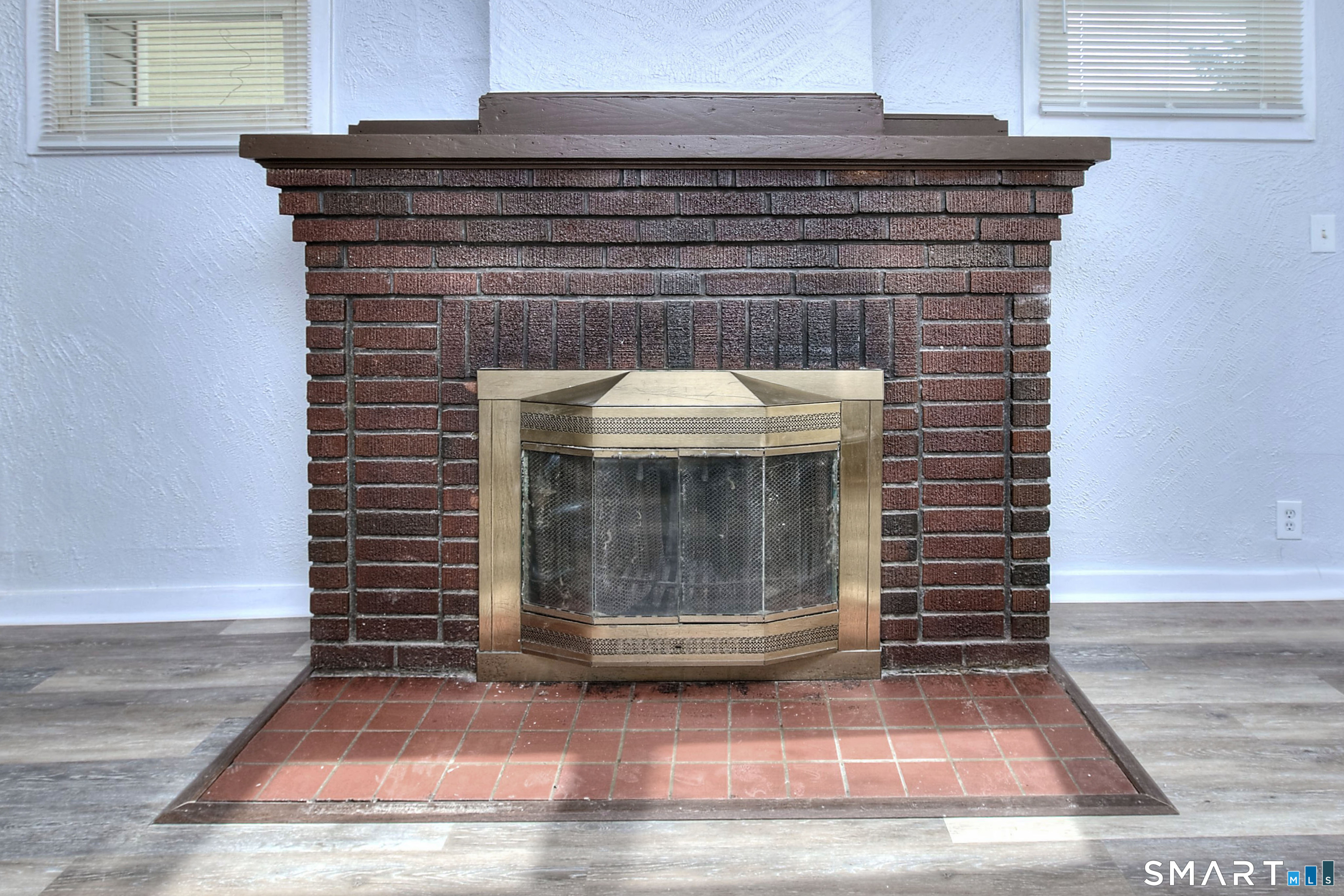 115 3rd Street Hamden, CT 06514 - Photo 4 of 34 a view of fireplace and window
