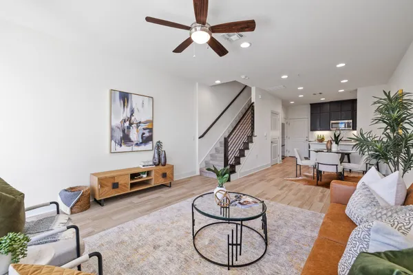 a living room with furniture and white walls