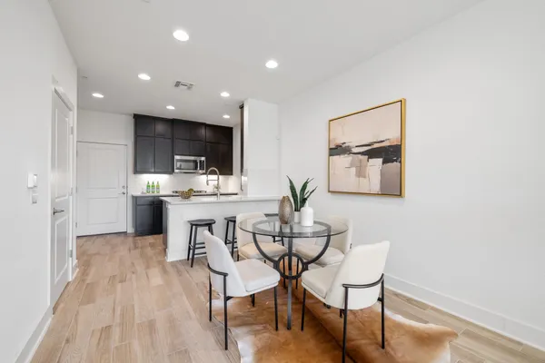 a kitchen with stainless steel appliances a stove refrigerator sink and cabinets