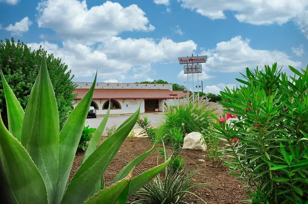 a view of sign board with a small yard
