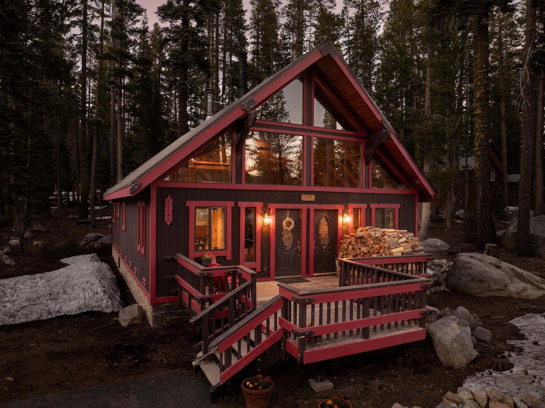 a front view of a house with balcony and trees