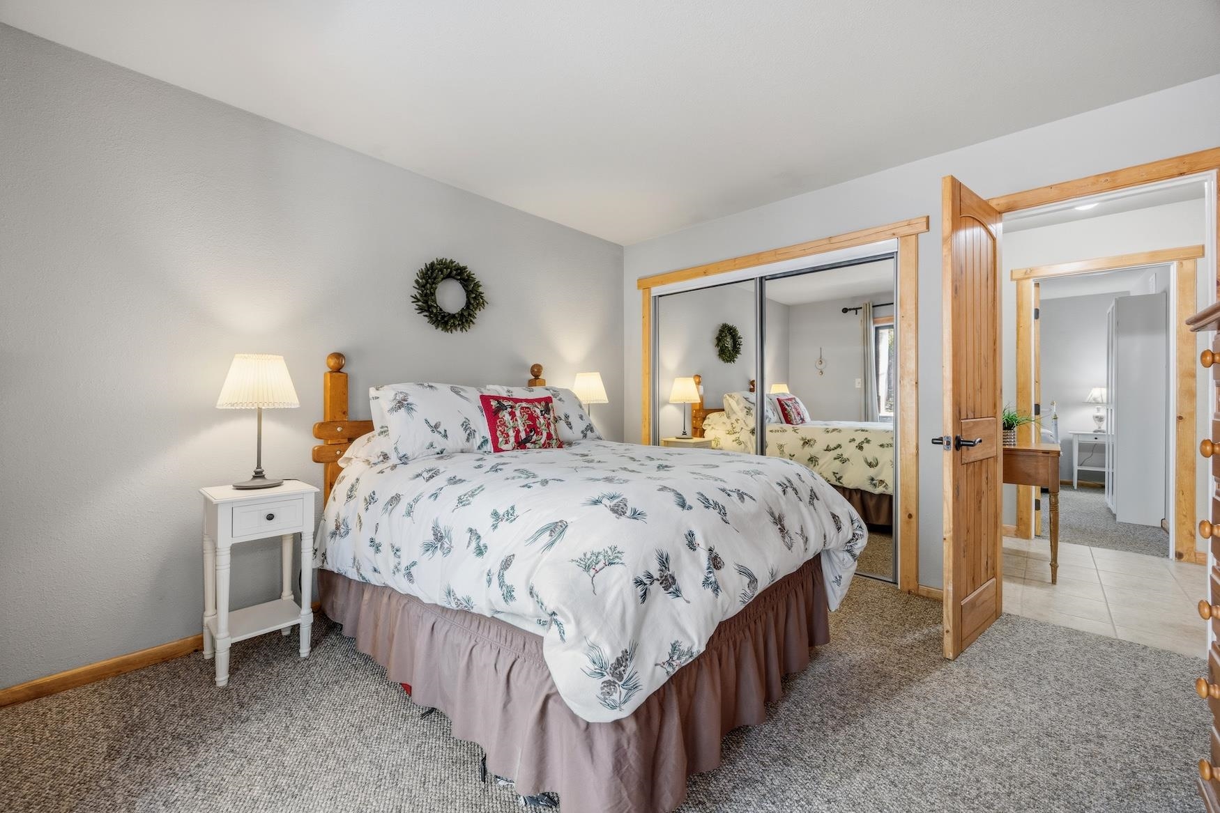 21146 Donner Pass Road Soda Springs, CA 95728 - Photo 12 of 25 a bedroom with a bed and a mirror